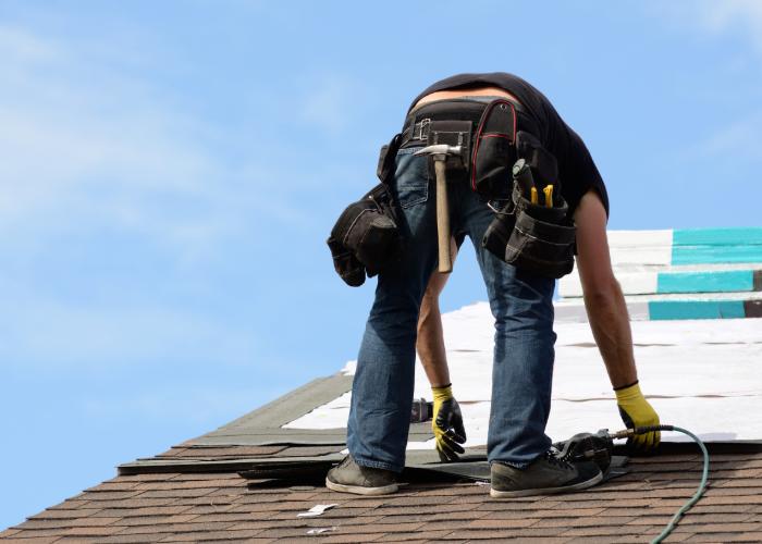 workers doing an emergency roof repair in Cranston home